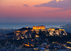 The majestic Parthenon and Acropolis glowing under the night sky of Athens.